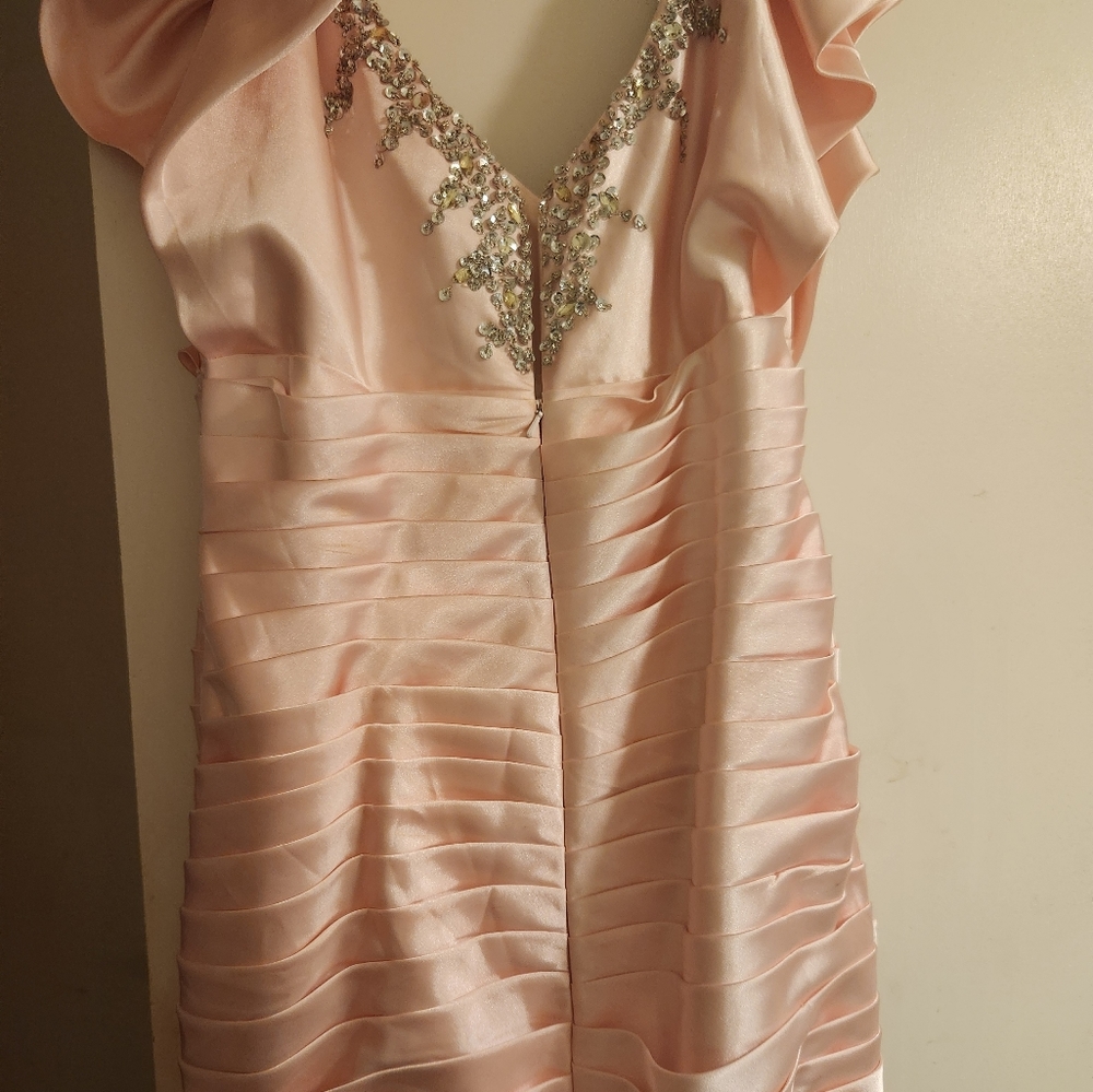 The dress was worn once size 14 or 16 fits small lot of sparkle